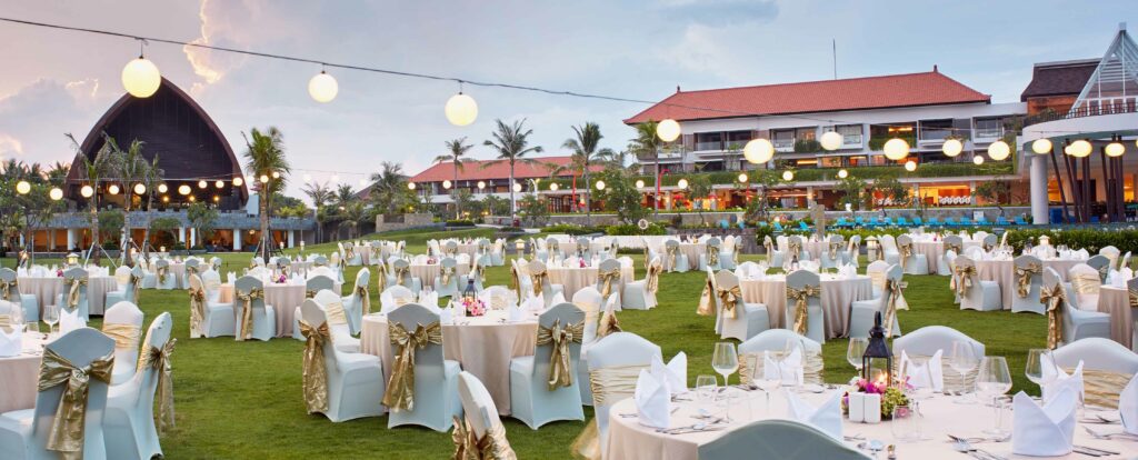 A sophisticated MICE event setup in a spacious ballroom at a Bali resort destination like Merusaka.