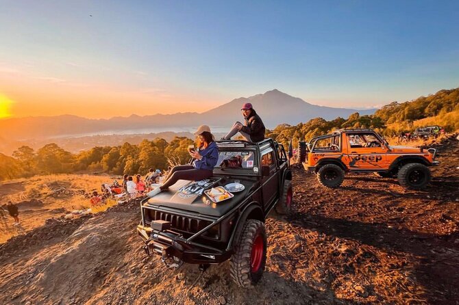 Breathtaking panoramic view from Kintamani viewpoint showing Mount Batur volcano and Lake Batur within the caldera, a highlight of a day trip from Nusa Dua.