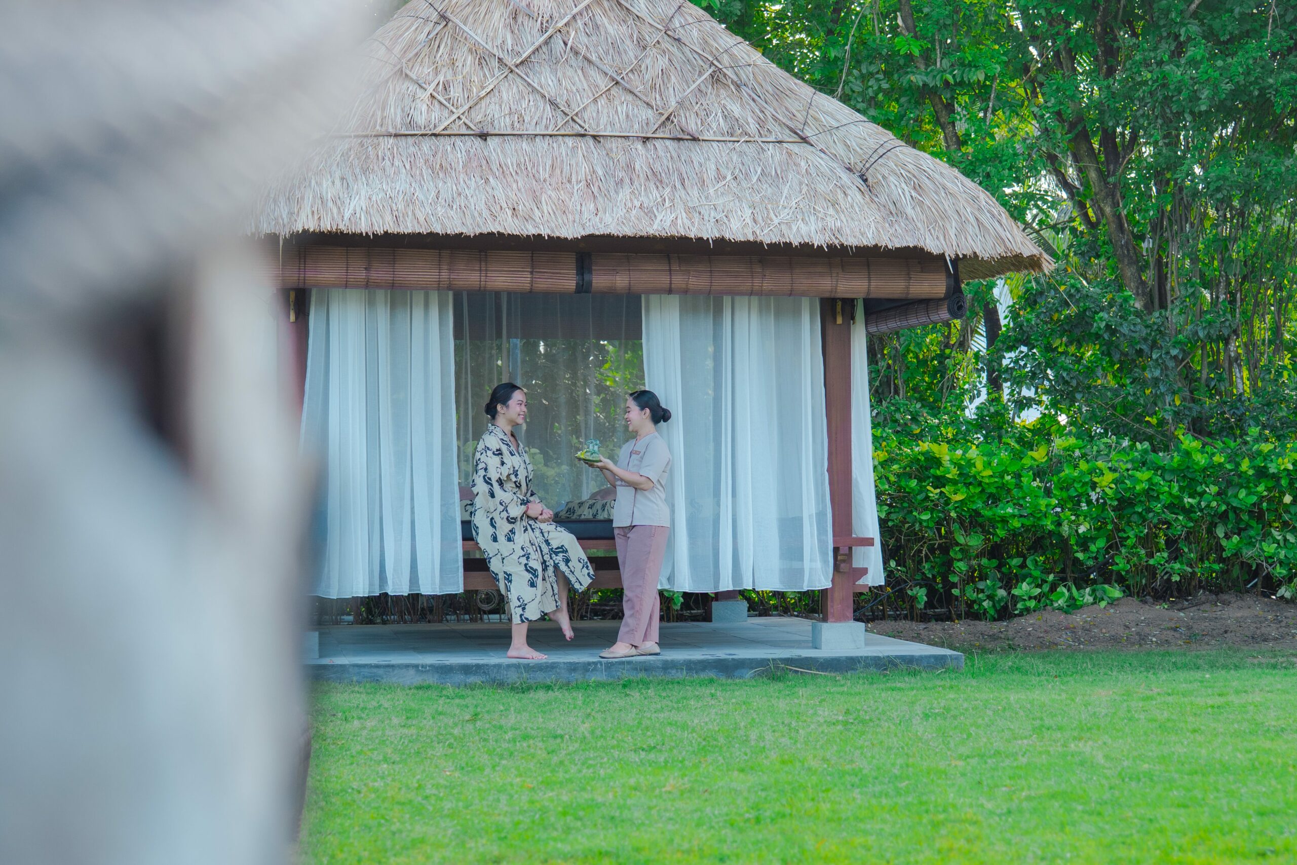 Private outdoor spa gazebo nestled in tropical gardens at THE SPA by Merusaka Nusa Dua